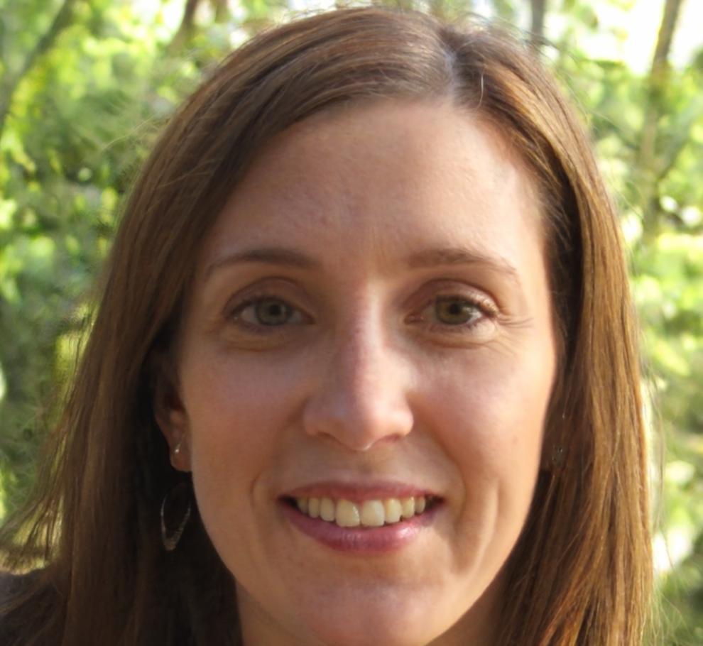 Professor Elena Kartouzou, international student advisor and editing instructor, smiling warmly in campus setting