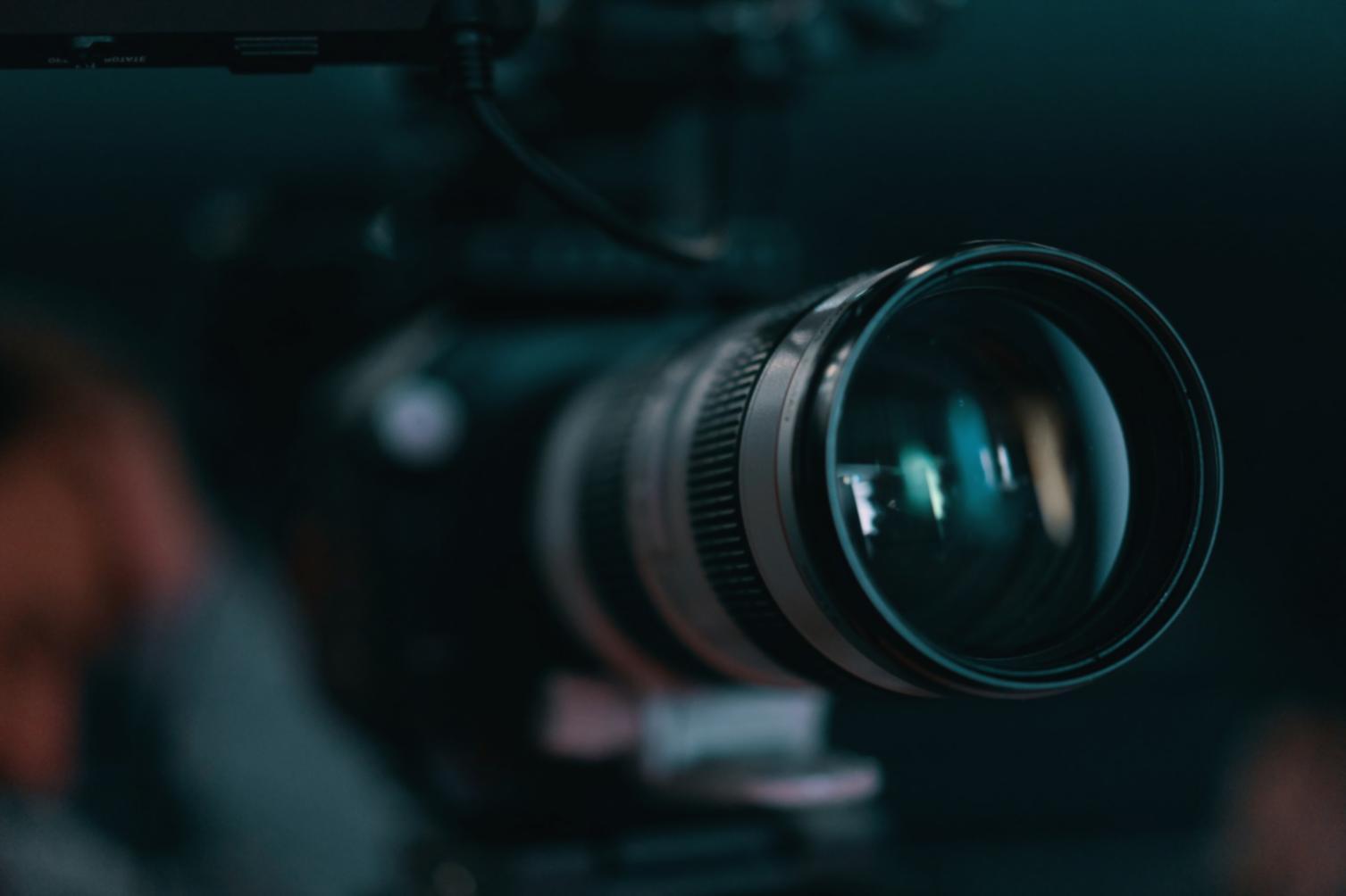 International students collaborating in modern editing studio with professional equipment and diverse creative workspace